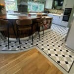 Windsor Victorian-style LVT tiles bordering wood-effect flooring in a kitchen