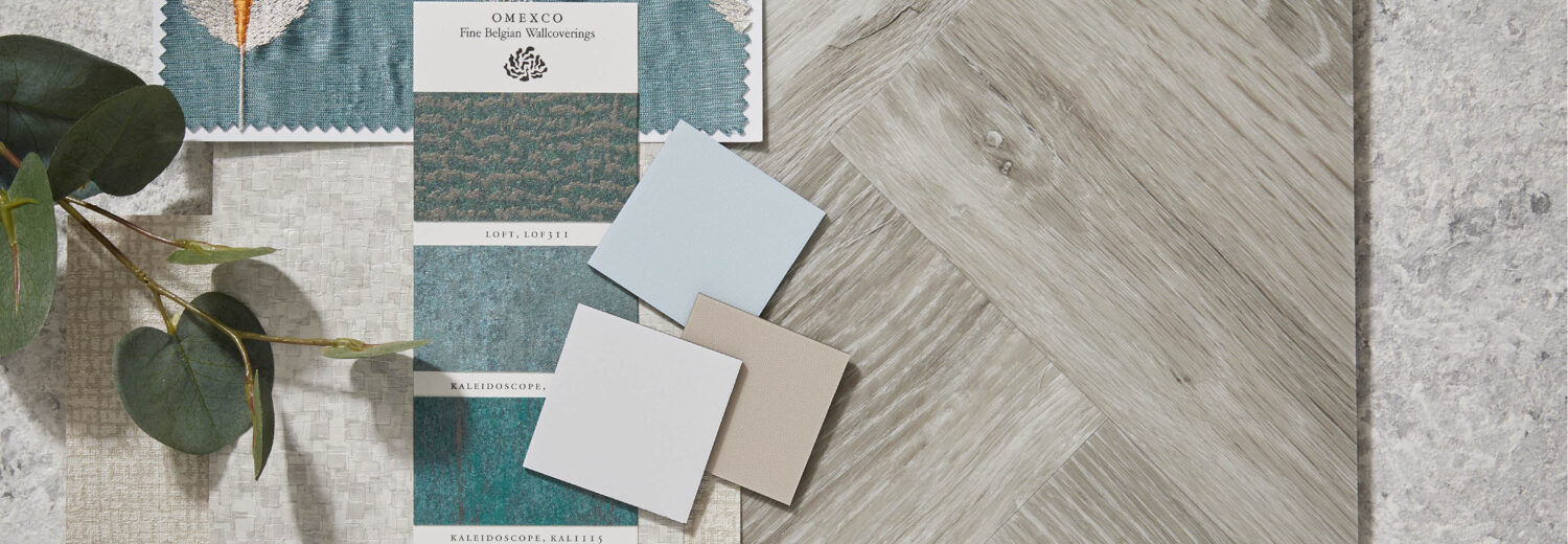 A moodboard containing an LVT sample, a carpet sample and a wallpaper sample.